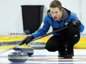 Skip Cole Peters, whose squad sits in third place at 3-1, delivers a rock during the junior men’s provincial championship on Friday. (BRIAN DONOGH/Winnipeg Sun)