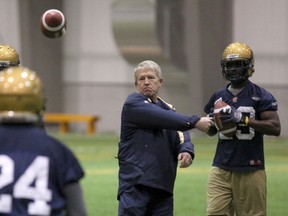 The Winnipeg Blue Bombers' defensive coach Tim Burke works with the players in Winnipeg, Manitoba Wednesday, April 13, 2011. MARCEL CRETAIN / QMI Agency