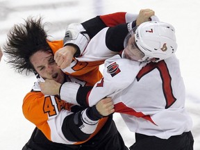 Senators centre Kyle Turris, right, and Flyers centre Danny Briere trade punches in only the second fight of Turris' NHL career. (Tim Shaffer/Reuters)