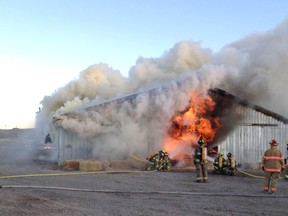 A fire fully engulfs a poultry barn just north of Lethbridge, Alta. on January 7, 2012. (RCMP photo)