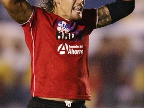 Jaguares goalkeeper Omar Ortiz celebrates his team's goal against Cruz Azul during their Mexican league championship soccer match at the Azul stadium in Mexico City, in this September 6, 2004 file photo. (REUTERS/Henry Romero/Files)