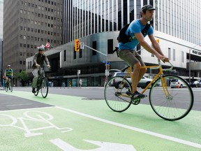 Not everybody is happy the city decided to build a bike lane on Laurier Ave. (Darren Brown/Ottawa Sun)