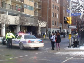 Bystanders gathered to watch a movie crew shooting Penthouse North on Somerset St. Sunday. The film stars Michael Keaton and Michelle Monaghan. DANIELLE BELL/OTTAWA SUN