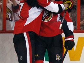 Senators captain Daniel Alfredsson celebrates his first-period goal against the Flyers on Sunday with teammate Filip Kuba. (Tony Caldwell, Ottawa Sun)