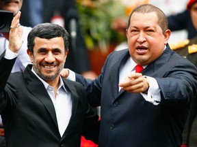 Iran’s President Mahmoud Ahmadinejad is welcomed by Venezuela’s President Hugo Chavez (R) at Miraflores Palace in Caracas January 9, 2012. Venezuelan President Hugo Chavez dismissed a U.S. warning to avoid closer ties with Iran on Sunday, denouncing what he said was Washington’s attempt to dominate the world as he welcomed Ahmadinejad to the Latin American nation. REUTERS/Carlos Garcia Rawlins