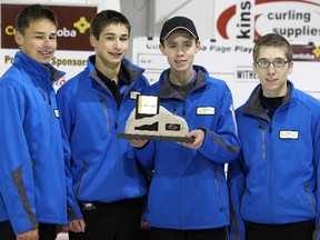 West Kildonan skip Kyle Doering (second right) and his team of (from left) Kyle Kurz, Colton Lott and Lucas Van Den Bosch accept the trophy after winning the title at the Canola Junior Men's Provincial Championship at West Kildonan Curling Club on Monday, Jan. 9, 2012. Doering downed Fort Rouge skip Joey Witherspoon to win the provincial title. (Jason Halstead, Winnipeg Sun)