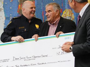Ottawa Police Chief Cern White and project S.T.E.P. partners presented a $2.25-million cheque to the Dave Smith Youth Treatment Centre Tuesday, January 10, 2012. (Tony Caldwell/Ottawa Sun/QMI Agency)