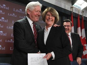 Interim Liberal Leader Bob Rae embraces his newest MP, Lise St-Denis, Tuesday in Ottawa. (Andre Forget/QMI Agency)