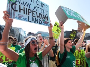 Protesters chant as they gather for a demonstration organized by Green Peace on Parliament Hill in Ottawa, Sept 26, 2011. The group is protesting against the proposed Keystone XL oil pipeline.  (Andre Forget/QMI Agency)