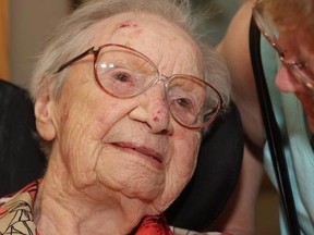 Providence Manor resident Edith Morey, left, is visited by granddaughter Evelyn Mavety as she prepares to celebrate her 110th birthday on Wednesday. (Michael Lea/QMI Agency)