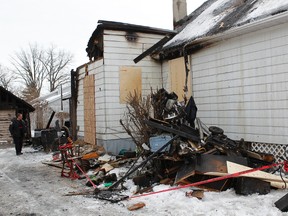 Seven people are homeless after a fire destroyed two houses in east end Gatineau. The remains of 56 Glaude Street shown here on Wednesday morning, Jan. 12, 2012.   
(TONY CALDWELL/OTTAWA SUN)