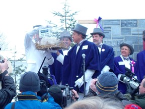 There’s lots of pomp and ceremony when Wiarton Willie emerges to give his prediction on when winter will end. This photo from 2005 shows Willie, Jim Mitchell, his handler (in the white tuxedo), and then-Mayor Carl Noble, Town of South Bruce Peninsula. (Handout)