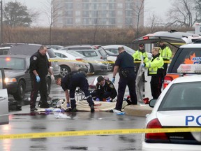 Cops and emergency personnel at scene in Oakville police station parking where man was shot dead by police Thursday. (Andrew Collins photo) Katherine Newman, below, was found dead in her nearby home shortly afterwards.