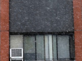 Air conditioners in the windows at 1390 and 1400 Lepage Ave. in Ottawa. Tenants who keep their units in over the winter aren't helping with Ottawa Community Housing's deficit. (TONY CALDWELL / OTTAWA SUN/ QMI AGENCY)