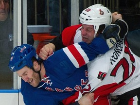 Zenon Konopka and Brandon Prust has a spirited first-period fight at Madison Square Garden on Thursday night. (Reuters photo)