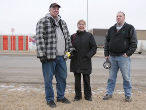 Glenn and Betty MacLeod stand outside of a storage locker auction with Crap2Cash owner Jon Stachyruk in Edmonton, Alberta, Jan. 12, 2012. The MacLeod's say there is an increase in the number of people showing up to auctions. Meanwhile, U-Haul has banned the cast and crew of Storage Wars from their property. (CATHERINE GRIWKOWSKY/QMI AGENCY)
