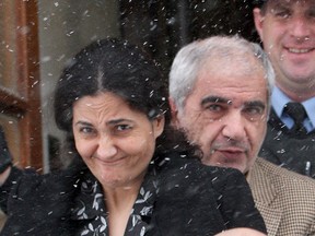 Tooba Mohammad Yahya leaves Frontenac County courthouse in Kingston on Friday January 13, 2012, after testifying at her murder trial. Yahya, along with her husband Mohammad Shafia (rear) and their son Hamed are each charged with four counts of first degree murder. (IAN MACALPINE KINGSTON/QMI AGENCY)