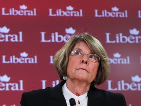 New Liberal MP Lise St-Denis looks up as she ponders a question during a press conference in Ottawa Jan 10, 2012. (ANDRE FORGET/QMI AGENCY)