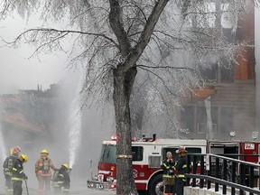 Winnipeg firefighters battle a fire in the 500 block of Sherbrook Street Saturday January 14, 2012.
BRIAN DONOGH/WINNIPEG SUN/QMI AGENCY