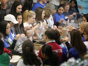 The 13th annual Project Winter Survival kit-packaging took place Saturday with more than 200 volunteers descending on the Bargains Group Ltd. building on Caledonia Rd to do their bit to help those less fortunate (VERONICA HENRI/Toronto Sun).