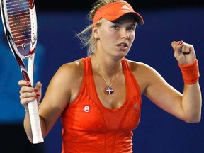 Caroline Wozniacki celebrates defeating Anastasia Rodionova during their women's singles match at the Australian Open in Melbourne on Monday, Jan. 16, 2012. (REUTERS/Tim Wimborne)