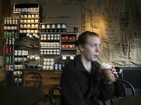 Mckenzie Harguth drinks her Frappuccino at a Starbucks store at 1st and Pike in Seattle, Washington, March 25, 2010. Reuters/Marcus Donner