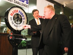 John Tory MCs as Toronto Mayor Rob Ford faces the scale and launches his Cut the Waist challenge Monday at city hall. (MICHAEL PEAKE/QMI Agency)