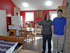 Kimberly Maich and her son Robert, age 18 stand in his combination bedroom/kitchenette in a home renovation facilitated through a federal assistance program. (BRIAN THOMPSON/QMI Agency)