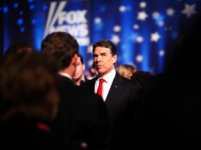 Republican presidential candidate Texas Governor Rick Perry is seen backstage during a break in a Republican presidential candidates debate in Myrtle Beach, South Carolina, January 16, 2012. REUTERS/Jason Reed