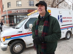 The Hope Mission's Ed Major poses for a photo with the Hope Mission Van, Tuesday. Major and his partner Gordon Coones (not pictured) have been patrolling the City's streets in the Hope Mission Van, looking to help Edmonton's less fortunate during the recent cold snap. DAVID BLOOM EDMONTON SUN
