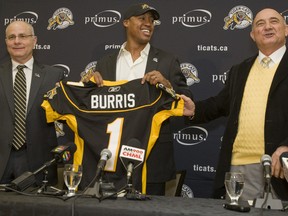 Henry Burris being introduced as the newest Hamilton Tiger-Cat quarterback was just one move in a slew of transactions that have made for a stormy off-season in the CFL. (JACK BOLAND/QMI Agency)