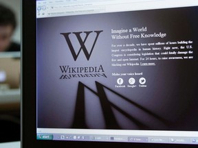 A reporter's laptop shows the Wikipedia blacked out opening page in Brussels January 18, 2012. (REUTERS/Yves Herman)