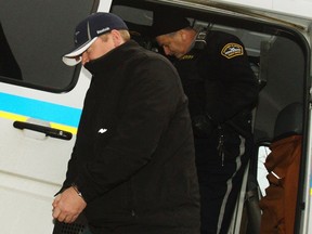 Jeffrey Paul Delisle arrives at the provincial court to face espionage charges in Halifax January 17, 2012. (REUTERS/Paul Darrow)