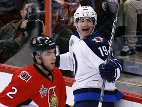 Winnipeg Jets' Jim Slater (right) celebrates his goal in front of Ottawa Senators' Jared Cowen during the first period of their NHL tilt in Ottawa Jan. 16, 2012. (CHRIS WATTIE/REUTERS)