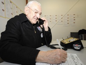 Bill Ross, seen here manning the phones for Minor Hockey Week in January 2010, and his staff still use rotary phones to gather data from the games over the course of the week. (Edmonton Sun file)