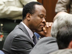 Dr. Conrad Murray closes his eyes after he was sentenced to four years in county jail for his involuntary manslaughter conviction of pop star Michael Jackson in Los Angeles, Nov. 29, 2011. (Mario Anzuoni /Pool/Supplied by WENN.COM)