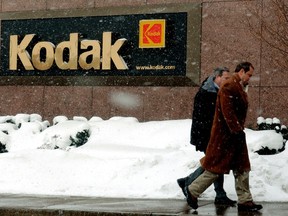 Workers walk past the Kodak corporate headquarters in Rochester, New York in this January 22, 2004 file photograph. (REUTERS/Stringer/Files)
