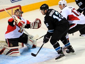 Senators goalie Craig Anderson keeps his eye on the puck as the Sharks' Patrick Marleau attacks the net Thursday night in San Jose.
