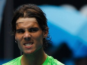 Rafael Nadal of Spain celebrates after defeating Lukas Lacko of Slovakia in their men's singles match at the Australian Open tennis tournament in Melbourne January 20, 2012. (REUTERS/Mark Blinch)