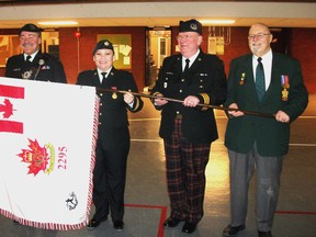 Shown with the new Royal Winnipeg Rifles Cadet Corps flag are, left to right: Lieutenant Colonel, John Robins of the Canadian Forces Liaison Council; Captain  Angela Brass, Commanding Officer of the Rifles Cadet Corps; Honourary Lieutenant Colonel Bob Vandewater, presenter of the flag; and Kenneth McCuaig, Lieutenant Colonel (Ret’d) of the Army Cadet League of Canada. (HANDOUT)
