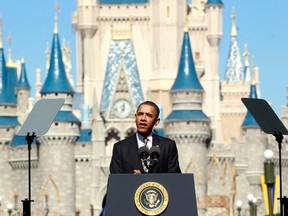 U.S. President Barack Obama unveils a strategy aimed at boosting tourism and travel in front of Cinderella's Castle at Disney World's Magic Kingdom in Orlando January 19, 2012. REUTERS/Kevin Lamarque