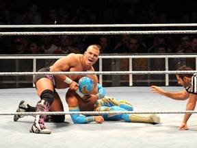Tyson Kidd (top), shown wrestling Sin Cara in Dublin last year, believes he has what it takes to be a WWE superstar. (Photo courtesy WENN.com)