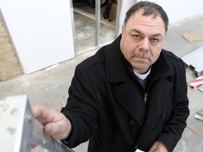 Winnipeg businessman Ian Block displays a Canada Post receipt for a shipment he made to Toronto. He was charged 13% HST, a tax that Manitoba does not charge, but Ontario does. (BRIAN DONOGH/Winnipeg Sun)