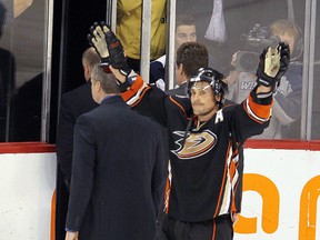 Anaheim Ducks right winger Teemu Selanne waves to the crowd as he leaves the ice following the Ducks 5-3 loss to the Winnipeg Jets in NHL hockey in Winnipeg Saturday, December 17, 2011. (BRIAN DONOGH//QMI AGENCY)