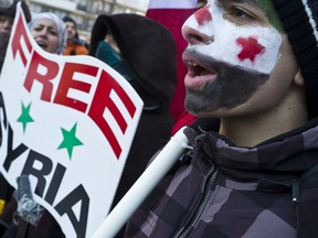 15 year old Hayan (no last name given) was amongst the protestors outside of the Syrian Embassy in Ottawa on Saturday Jan, 21,2012.
(ERROL MCGIHON/OTTAWA SUN)
