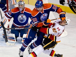 Jeff Petry collides with Lance Bouma during the first period of the Edmonton Oilers against the Calgary Flames at Rexall Place on Saturday.
Codie McLachan, Edmonton Sun