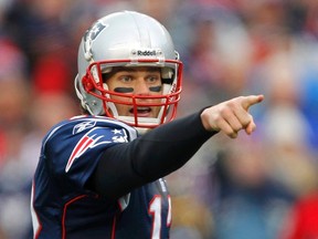 New England Patriots quarterback Tom Brady points on the line of scrimmage before a play against the Baltimore Ravens during their NFL AFC Championship football game in Foxborough, Massachusetts, January 22, 2012. REUTERS/Adam Hunger