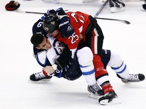 Winnipeg Jets' Evander Kane (left) tangles with Ottawa Senators' Chris Neil during the first period of their NHL hockey game in Ottawa on Jan. 16, 2012. Kane, sidelined with concussion-like symptoms, has been sorely missed by his team. (CHRIS WATTIE/REUTERS)