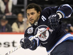 Winnipeg Jets defenceman Dustin Byfuglien fires a shot on net prior to playing the Montreal Canadiens in NHL hockey in Winnipeg on Thursday, Dec. 22, 2011. (Brian Donogh, Winnipeg Sun files)