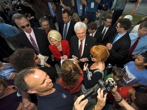 Republican presidential hopeful Newt Gingrich (C) and his wife Callista Gingrich (L) meet with supporters during a campaign rally in Tampa, Florida, January 23, 2012.  REUTERS/Steve Nesius